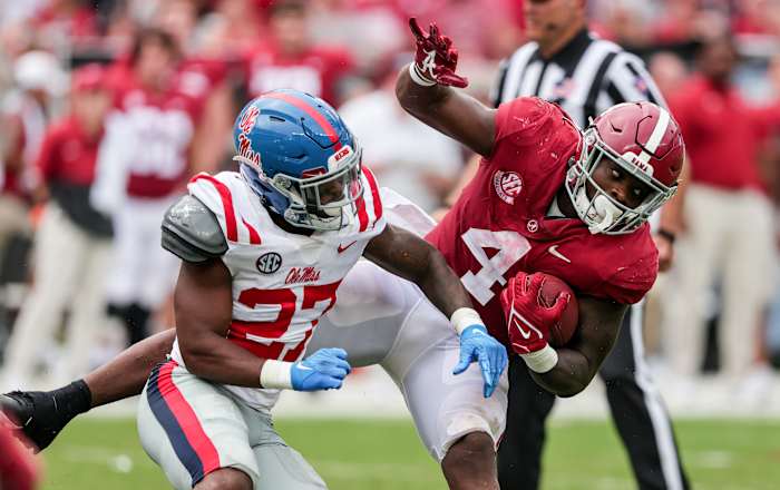 Oct 2, 2021; Tuscaloosa, Alabama, USA; Alabama Crimson Tide running back Brian Robinson Jr. (4) is tackled by Mississippi Rebels defensive back Tysheem Johnson (27) during the second half of an NCAA college football game at Bryant-Denny Stadium.